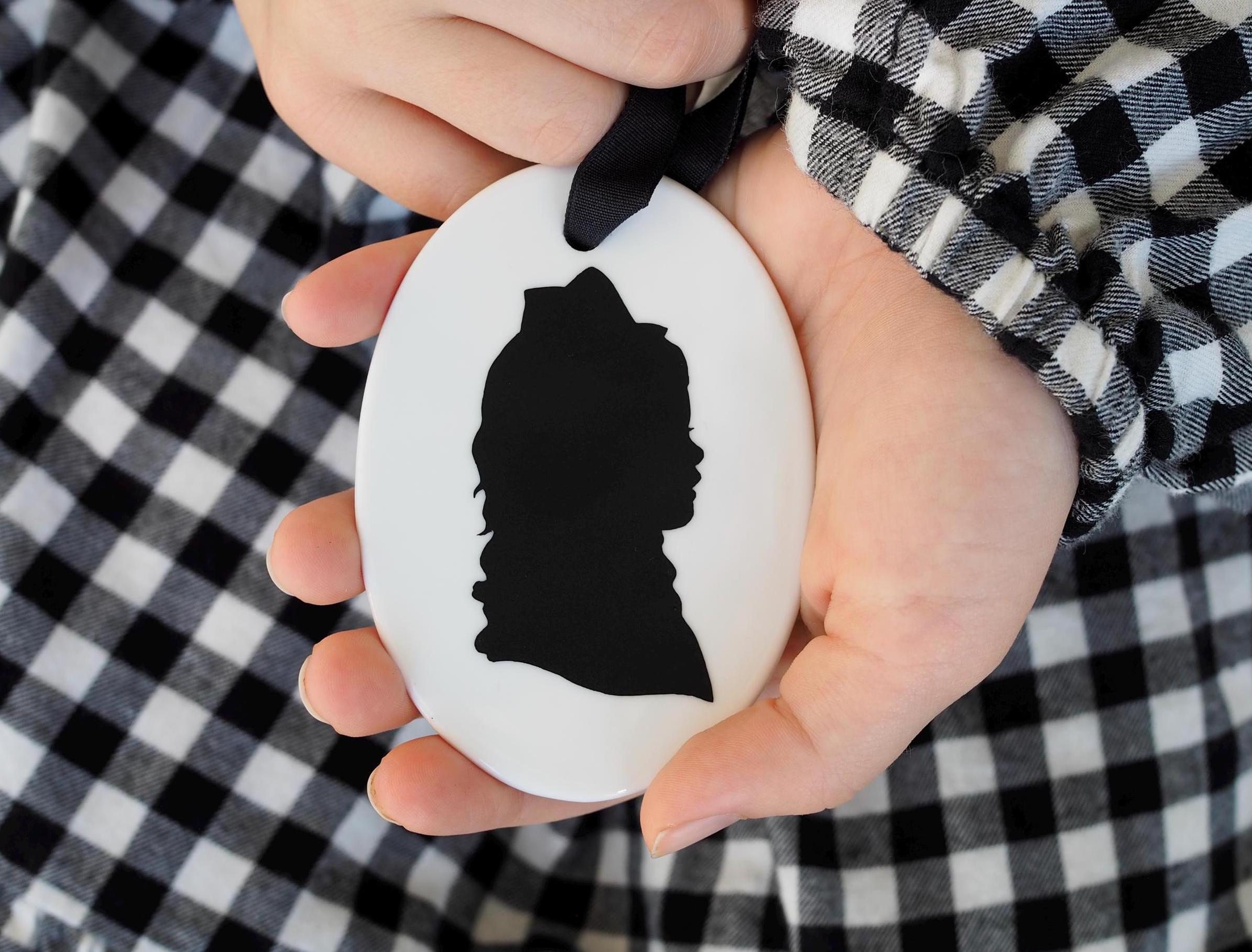 Personalized White Ceramic Oval Christmas Ornament with Hand-Cut Child Silhouette