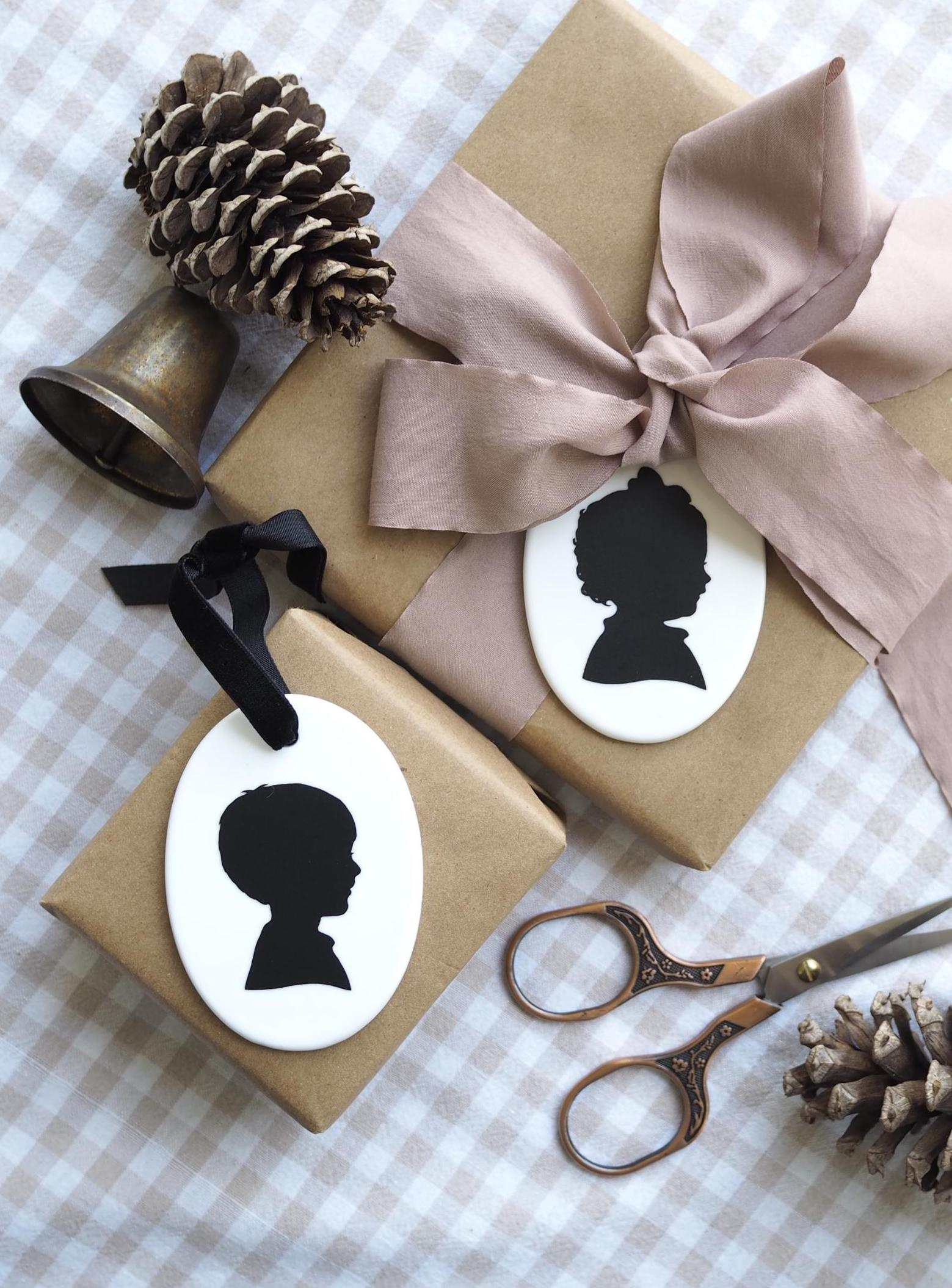 Personalized White Ceramic Oval Christmas Ornament with Hand-Cut Child Silhouette 1 - MeasureMason Personalized White Ceramic Oval Christmas Ornament with Hand-Cut Child Silhouette 1