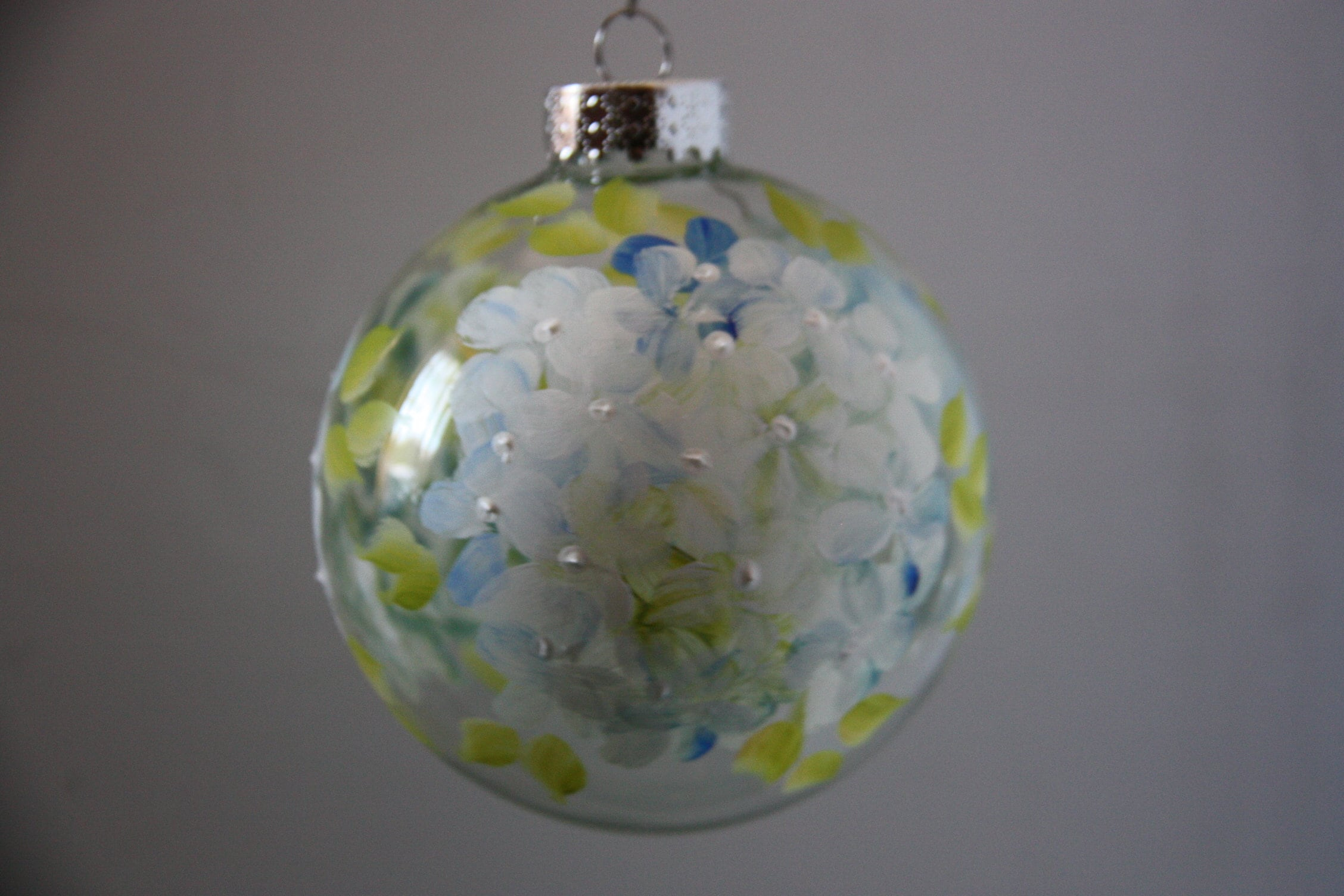 Hand-Painted Round Glass Christmas Ornament with Blue Hydrangea Floral Design