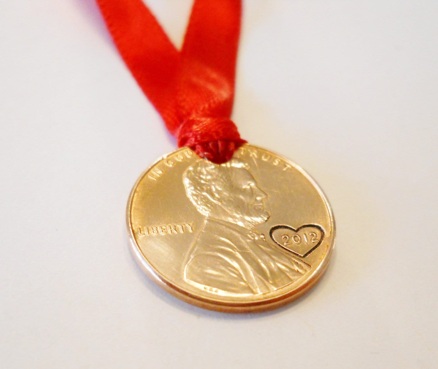 Hand-Stamped Lincoln Penny Christmas Ornament with Custom Year (1959-2025) Hand-Stamped Lincoln Penny Christmas Ornament with Custom Year (1959-2025)