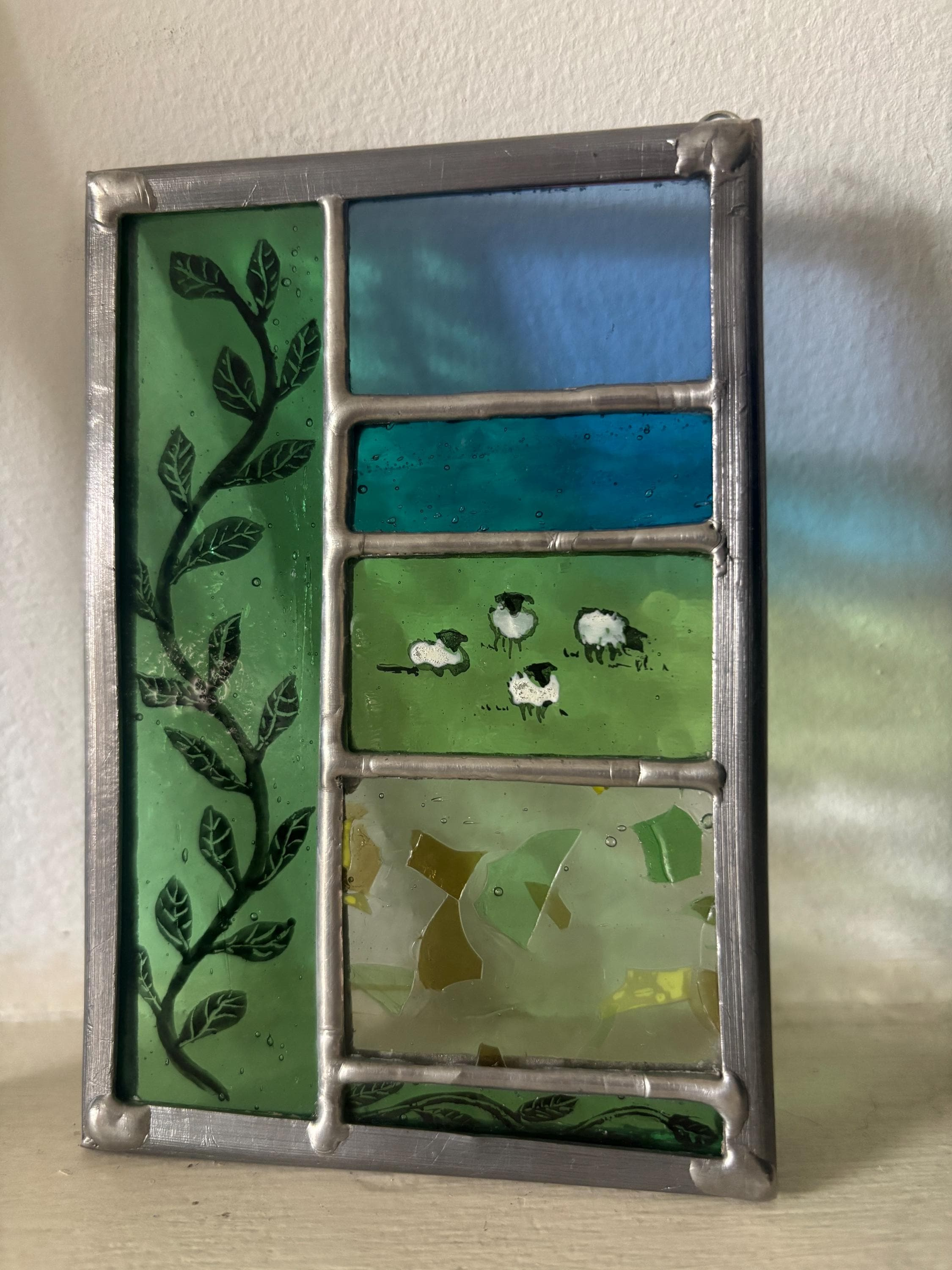 Mini Stained Glass Sheep Suncatcher - Handmade Painted Flock with Foliage, 8cm x 12cm Hanging Window Glass Panel Mini Stained Glass Sheep Suncatcher - Handmade Painted Flock with Foliage, 8cm x 12cm Hanging Window Glass Panel
